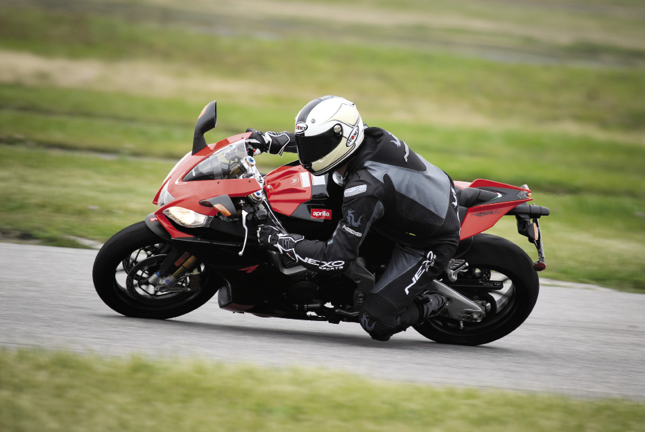 The RSV4 Factory is a serious performance machine that also happens to be street legal. The author describes it as a “race bike with headlights, turn signals and a license plate holder.”